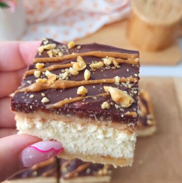 Reeses Cheesecake Square w/ vanilla cheesecake, peanut butter cream, chocolate ganache