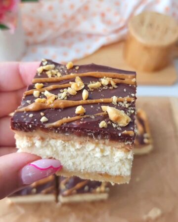 Reeses Cheesecake Square w/ vanilla cheesecake, peanut butter cream, chocolate ganache