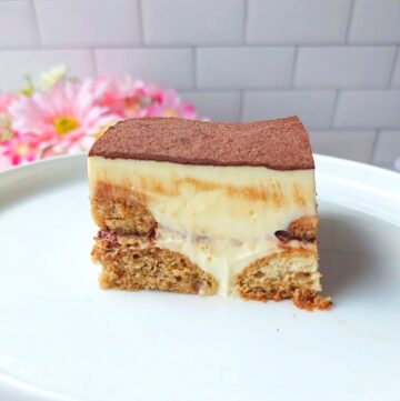Slice of sugar free tiramisu on a white plate