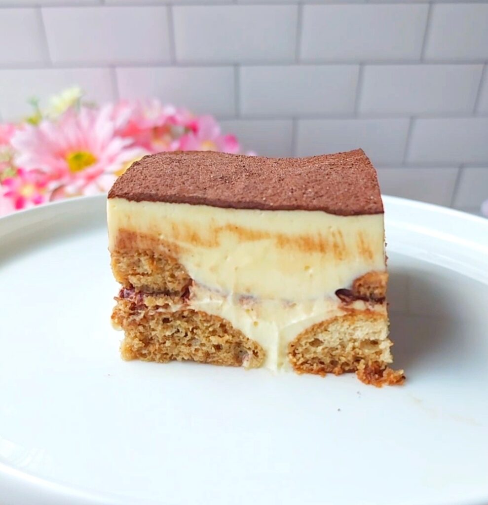 Slice of sugar free tiramisu on a white plate