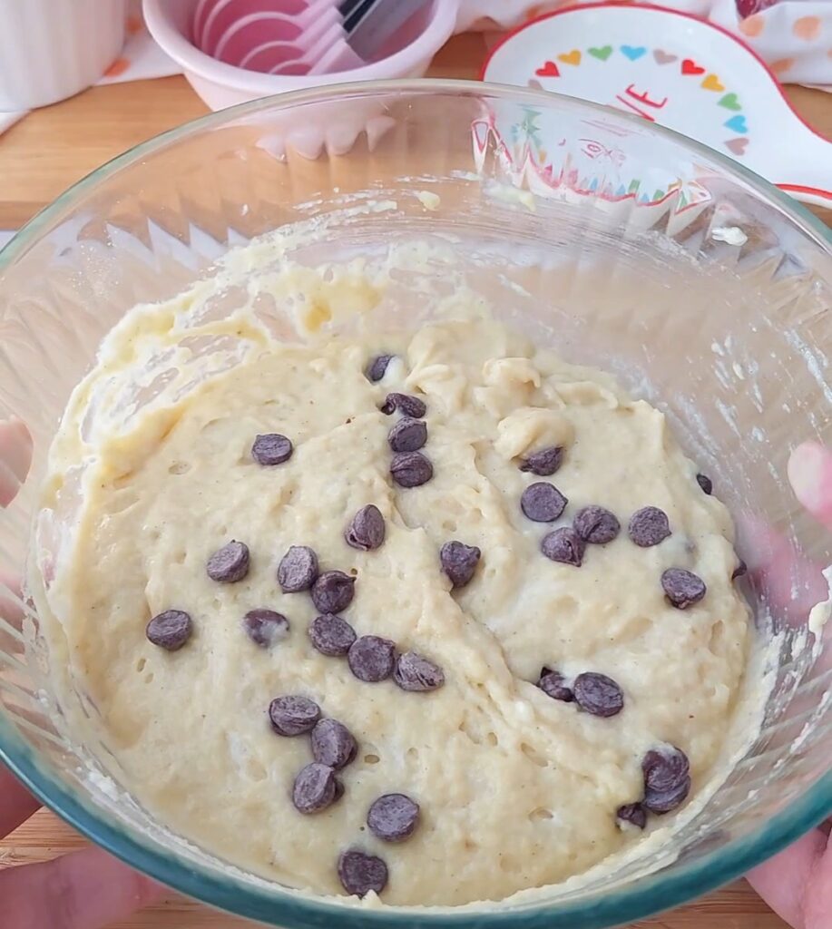 Muffin batter in a clear bowl. Rest 30 minutes